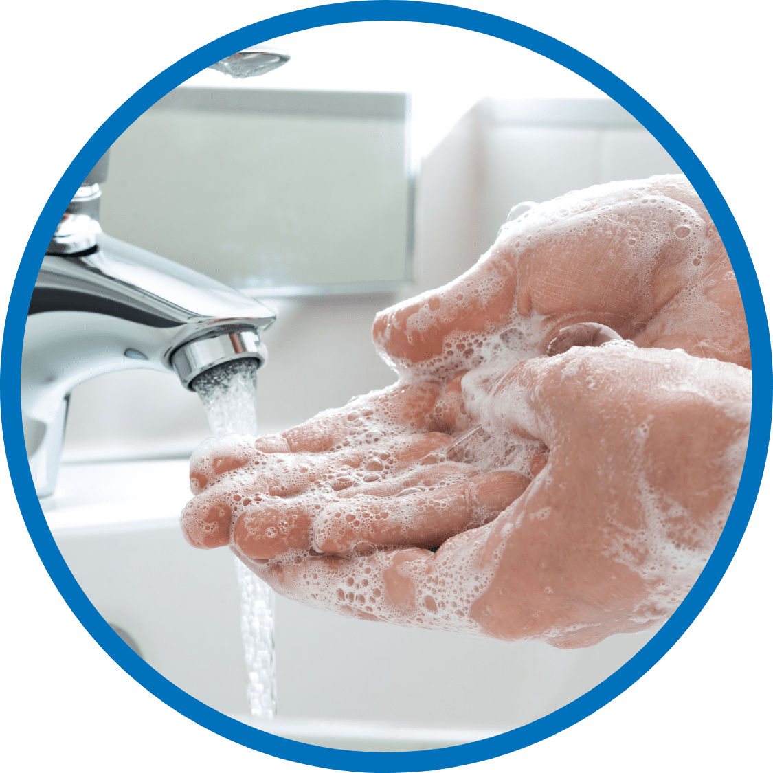 Close-up of hands being washed under running water