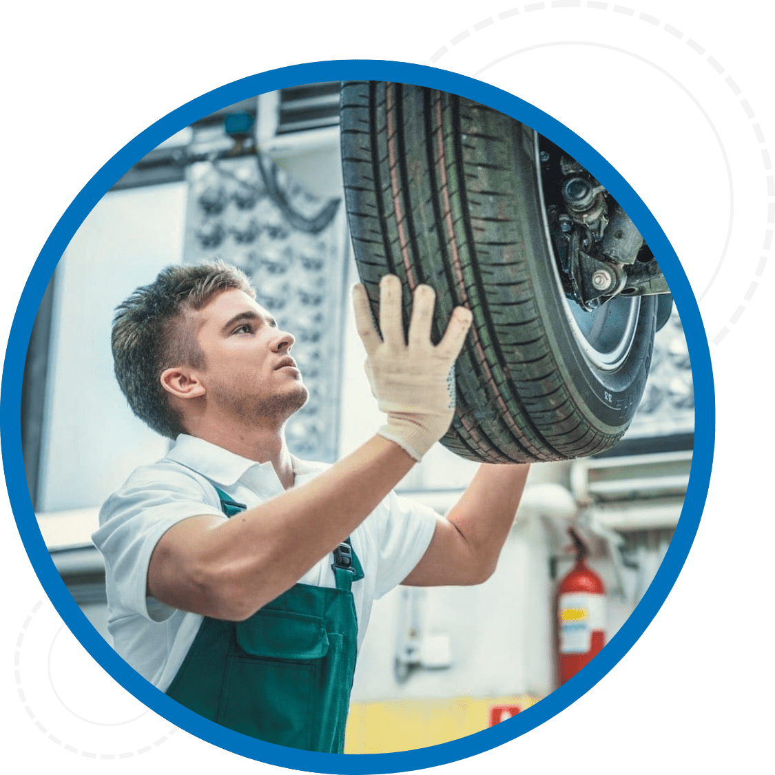 Technician wearing a clean uniform installing a tire on a vehicle