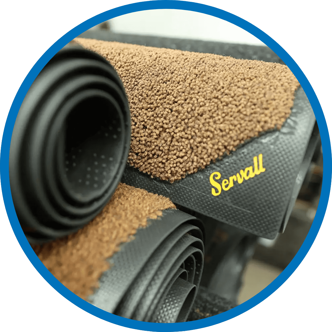 Stack of rolled Servall floor mats ready for delivery