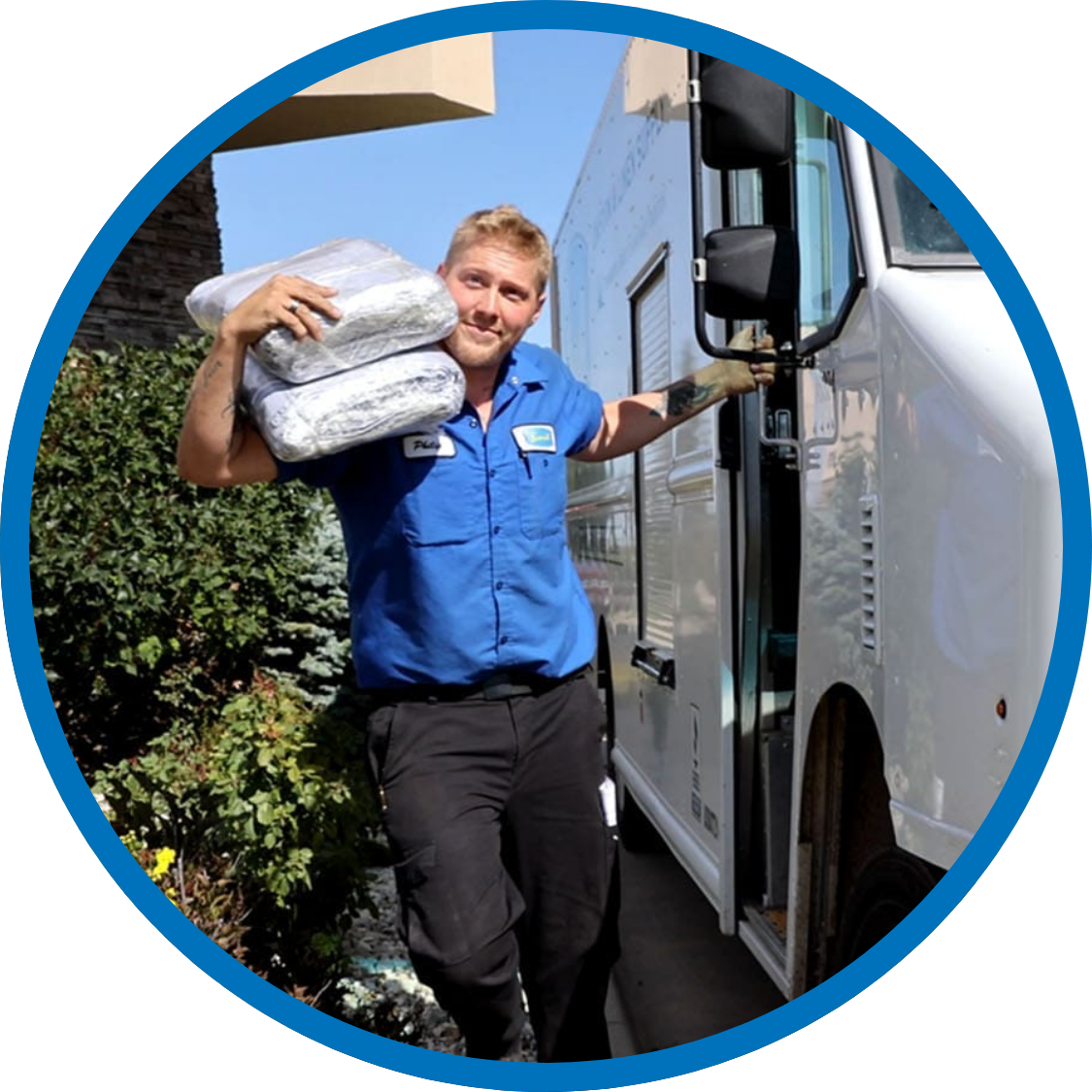 Servall driver delivering ice melt to a business