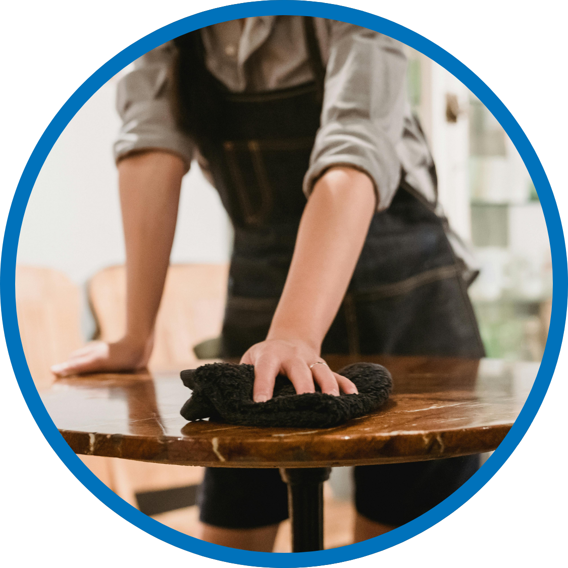 Restaurant staff cleaning table inbetween guests