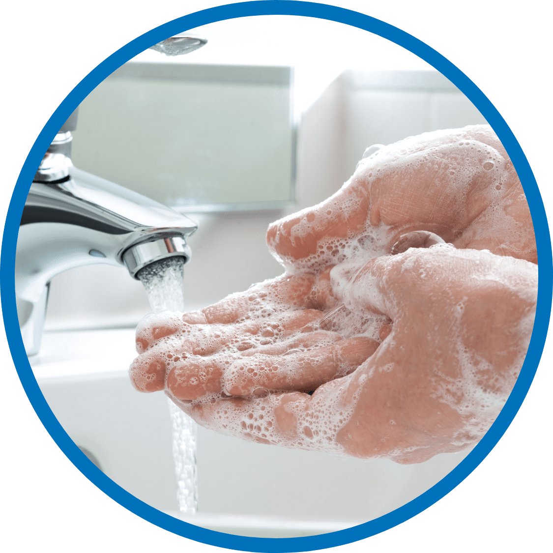 Close-up of hands being washed under running water