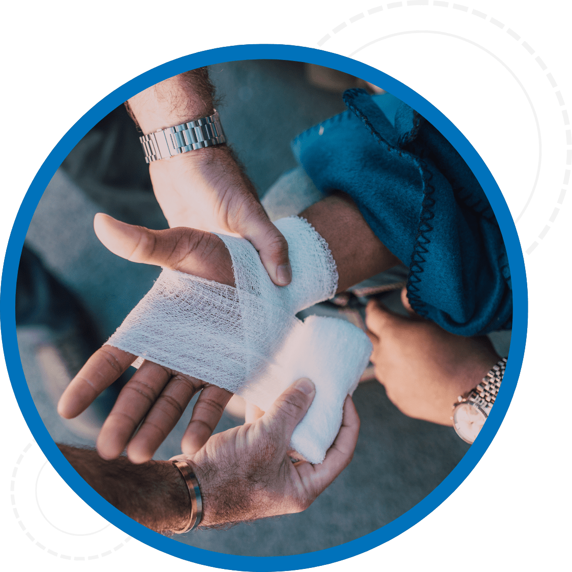 Close up of hands using first aid supplies and wrapping another hand in gause